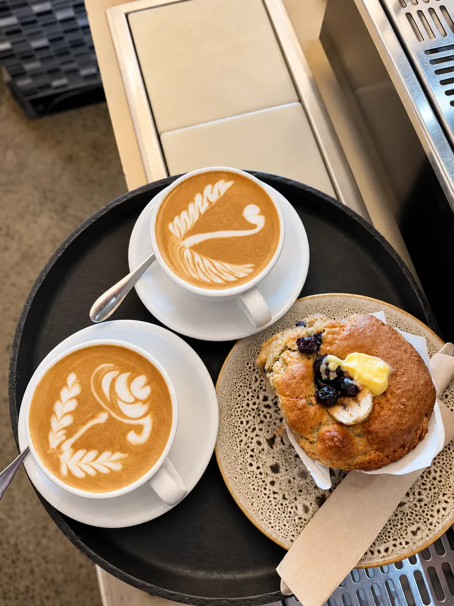 Two coffees and a baked treat at Zone Cafe